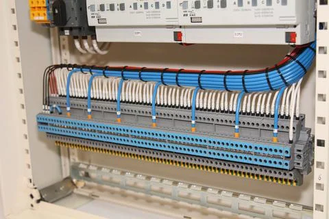 Connecting through-pass electrical terminals in the electrical panel Stock Photos