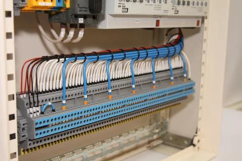 Connecting through-pass electrical terminals in the electrical panel Stock Photos