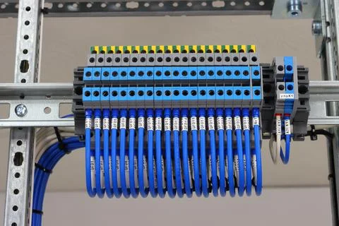 Connecting through-pass electrical terminals in the electrical panel Stock Photos