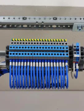 Connecting through-pass electrical terminals in the electrical panel Stock Photos