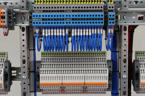 Connecting through-pass electrical terminals in the electrical panel Stock Photos