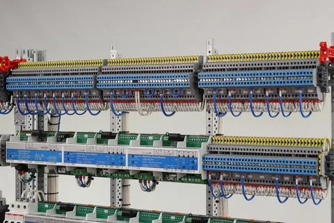 Connecting through-pass electrical terminals in the electrical panel Stock Photos