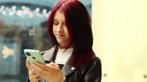 Connecting through technology in a vibrant urban setting at dusk Stock-Footage 295267428