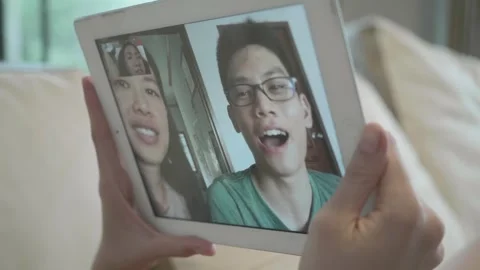 Connecting Through Video Chat on a Tablet Stock Footage 314455817