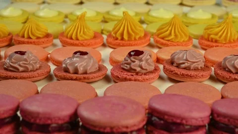 Connecting two halves of macaroons Stock Footage 120401365
