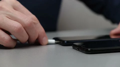 Connecting two phones for charging, data transfer, battery charging. Stock Footage 221345221
