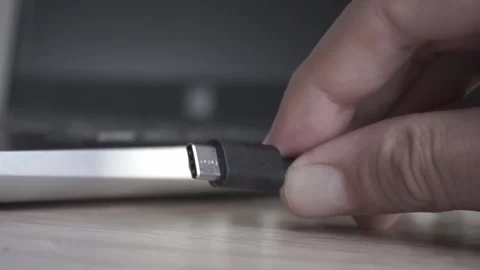 Connecting USB-C Cable to Port on Laptop Computer Stock Footage 155110692