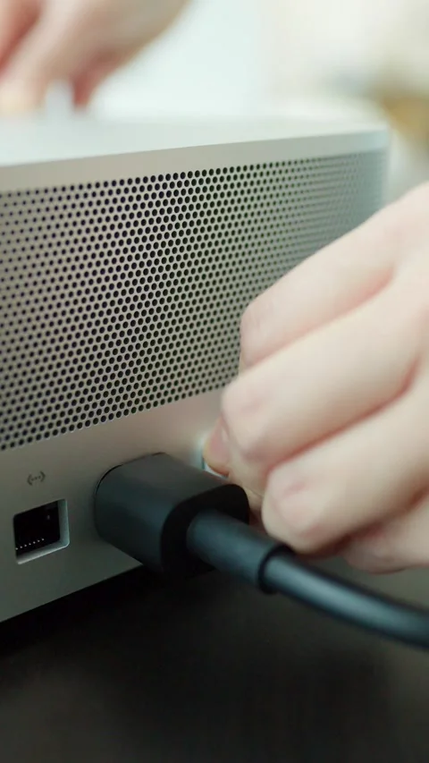 Connecting USB Cable to Desktop Computer in Modern Office Stock Footage 323148579