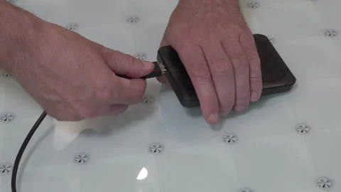 Connecting USB cable to external hard drive. Stock-Footage 332240478