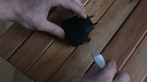 Connecting usb cable at recharger Stock Footage 55532795
