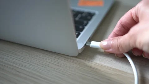 Connecting the USB Type-C cable to the laptop socket. Stock Footage 342785650