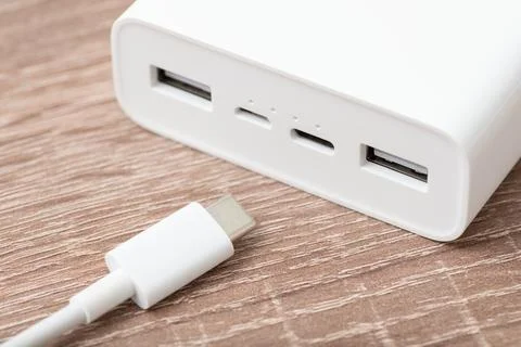 Connecting usb type c cable to power bank Stock Photos
