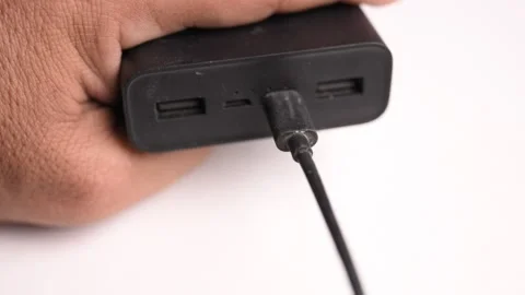 Connecting USB Type C Charging Cable to Power Bank Stock Footage 340610960