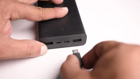Connecting USB Type C Charging Cable to Power Bank Stock Footage 340611031