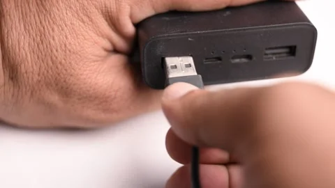 Connecting USB Type A Cable to Power Bank Stock Footage 340610989