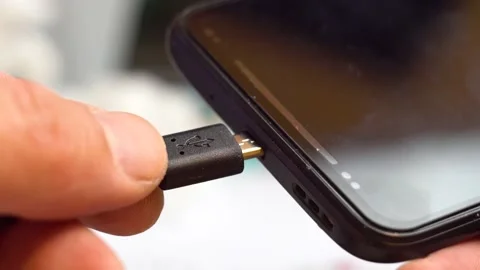Connecting the usb wire to a smartphone 4K Video stock 170065673