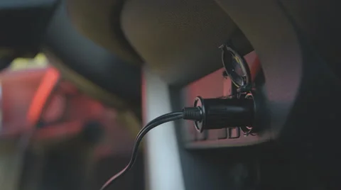 Connecting wires via cigarette lighter socket in the car Stock Footage 55250150