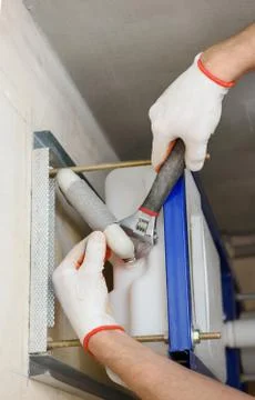 Connection of the pipe to the built-in tank. Stock Photos