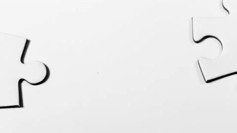 Connection. stop motion video 4k fit two puzzle pieces together Stock Footage 149943183