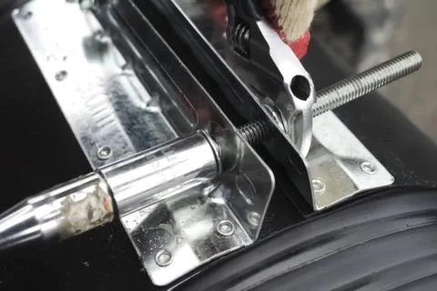 CONNECTION of two ends of polypropylene pipes with clamps. Stock Photos