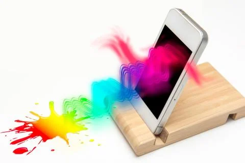 Connectivity and communication concept woth bright color flowing from a mobil Stock Photos