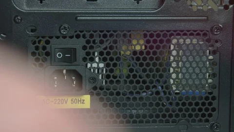 Connector and a button to turn off the power supply to the computer close up. Vídeos de archivo 102465995