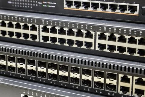 Connectors of a large data center network switch. incoming and outgoing outputs Stock Photos