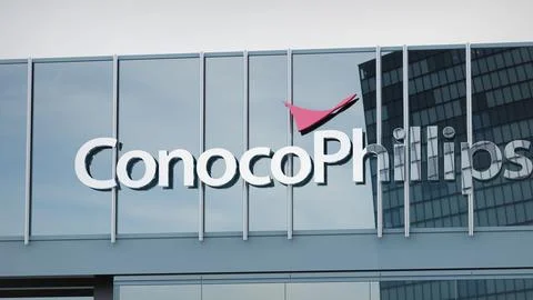 ConocoPhillips Stock data presented on the logo of the office facade editorial Stock Photos