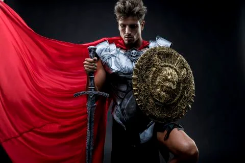 Conqueror, centurion or Roman warrior with iron armor, military helmet with h Foto stock