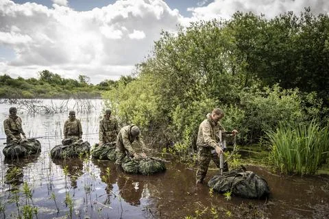 Conscripts from the Life Guards during military exercise at Danish Kulsbjerg Tra Stock Photos