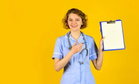 Consent to processing of personal data. Sign here. Woman doctor prescribing Stockfoto's