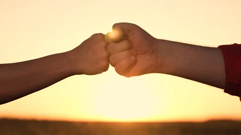 Consent trust sign at sunset. harmony of successful friendship. beat fists at Video stock 249900201