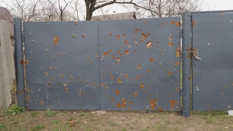 Consequence of shelling residential gate after air attack. War in Ukraine. Stock-Footage 244049059