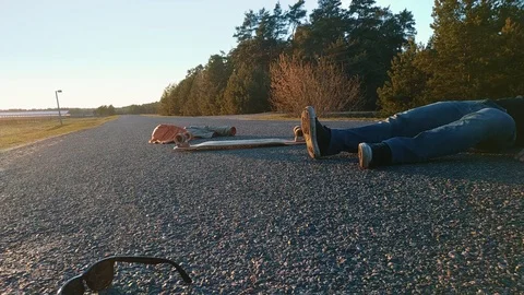 The consequences of the accident, the skater after the accident lying on the Stock Footage 106522812