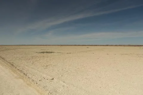 Consequences of Aral sea catastrophe. Sandy salt desert on the place of forme Stock Photos