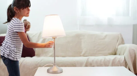 Conservation - A Child Turns Off a Light in the House Stock Footage 27962162