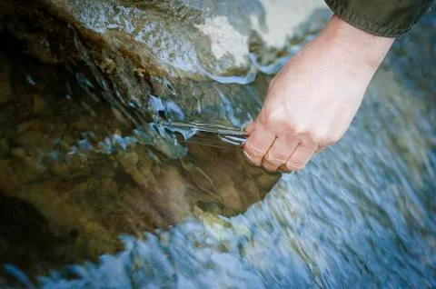 Conservationist gathers water samples Stock Photos