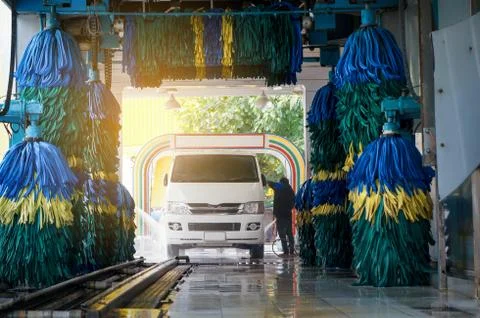 Conservative automatic carwash machine with sunlight effect Stock Photos