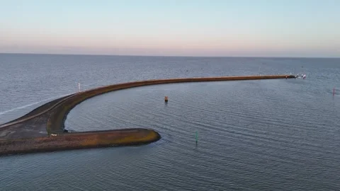 Conservative lateral pass along curved outer harbor wall Stock Footage 331841657