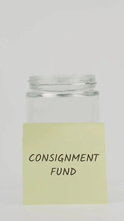 Consignment fund text or word on yellow sticky note attached to glass jar Stock Footage 311696674