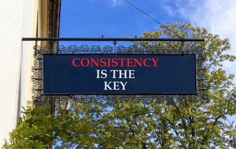 Consistency is the key symbol. Concept words Consistency is the key on black  Foto stock