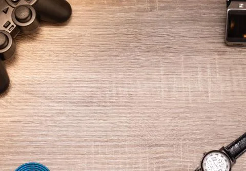 Console controller retro watch,digital watch, on a wooden surface. Flat lay w Stock Photos