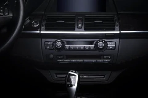 Console panel of the car, dark interior Stock Photos