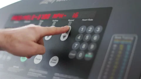 Console of a treadmill, increasing speed, exercise, gym, pressing buttons. 4K Stock Footage 230197148