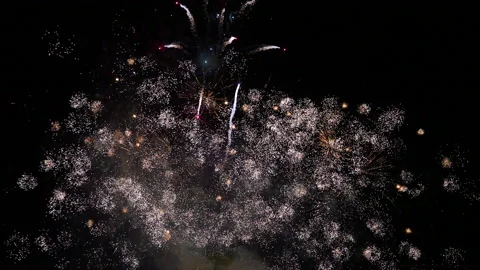 Constant barrage of small fireworks across the screen slow motion Video stock 235059594