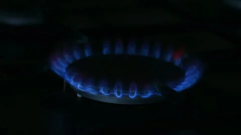 Constant burning of gas, blue flame of the gas stove burner. Stock Footage 238024720