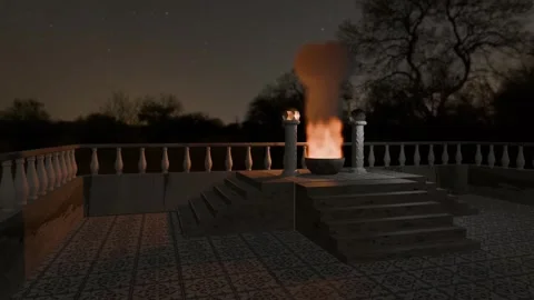 Constant fire in a stone pot between two columns of an ancient temple. Stock Footage 331051671