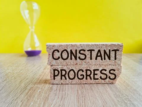 Constant Progress symbol. Brick blocks with concept words Constant Progress. Stock Photos