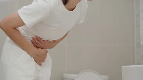 Constipation and diarrhea in bathroom. Hurt woman touch belly  stomach ache.. Stock Footage 236663833