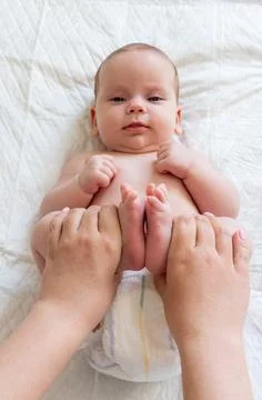 Constipation troubles eased by massage. Concept of infant well-being Foto stock